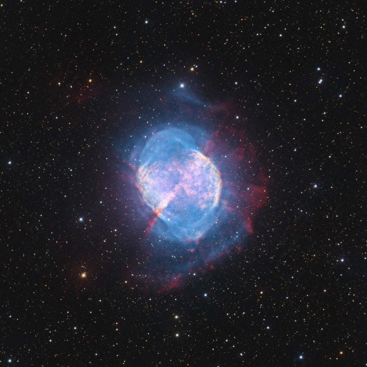 M27 is the Dumbbell Nebula, which lies more than 1,200 light-years away and glows at an apparent magnitude of 7.5. The clumps of gas and dust seen in this planetary nebula are caused when the stellar winds are not powerful enough to disperse them. As the nebula expands, the clumps are reshaped.