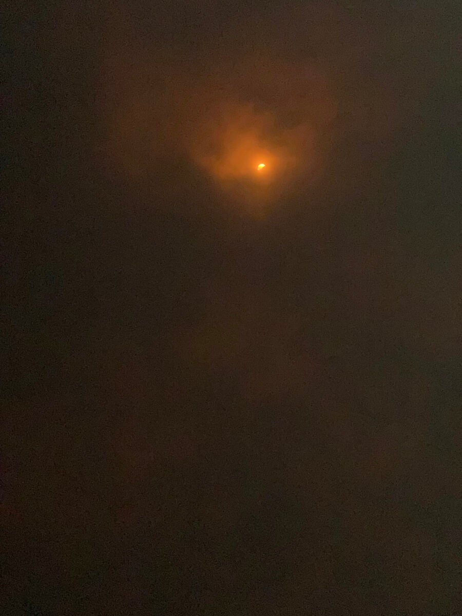 This partially cloud-obscured view of the partial phases was typical of those who saw the eclipse in Texas.