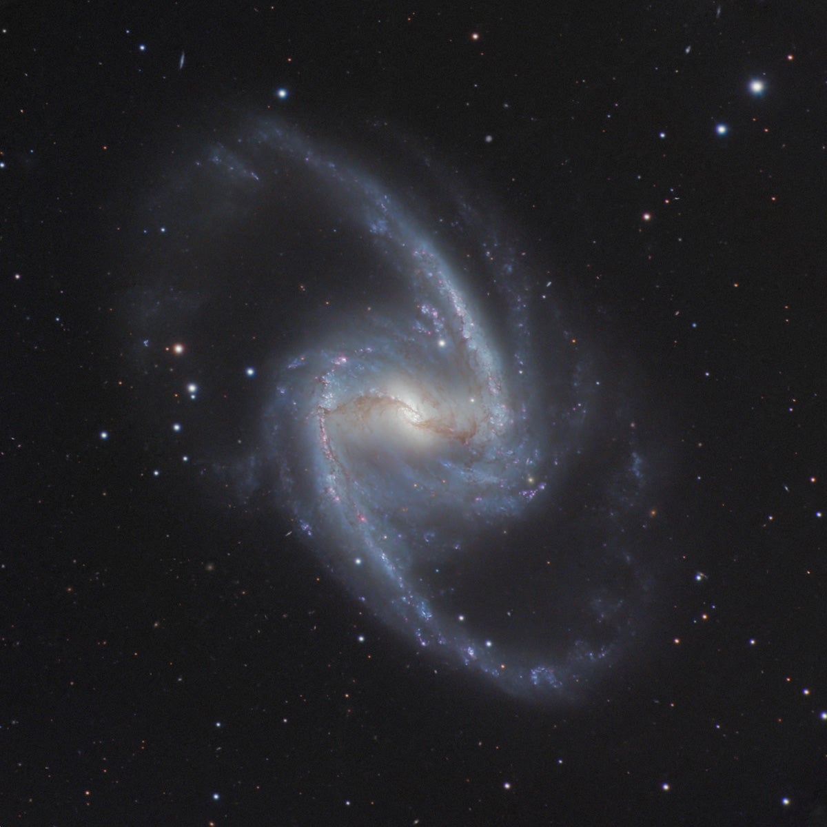NGC 1365 is such a perfect example of a barred spiral that it is has earned the nickname the Great Barred Spiral Galaxy.