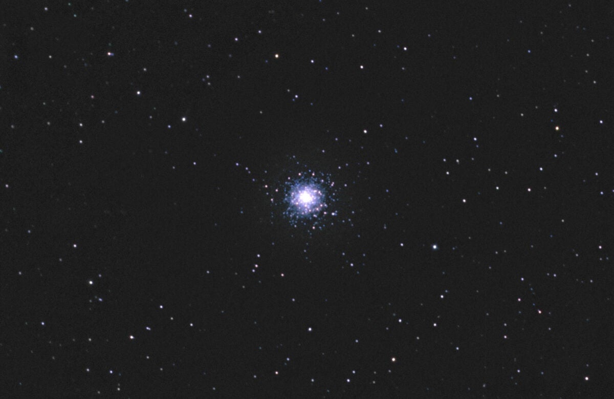 M79 is a wintertime globular in the southern constellation Lepus, south of Orion. The arc of stars above the core doubles back on itself in a V-shape on its left side, then trails off to the left.