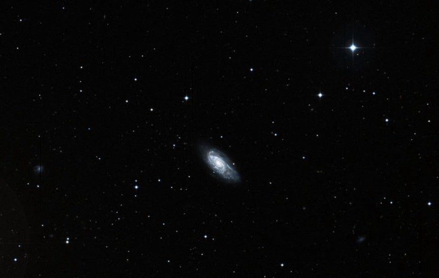 The flaky, patchy appearance of the arms of NGC 5676 gives it the designation of a flocculent spiral galaxy.